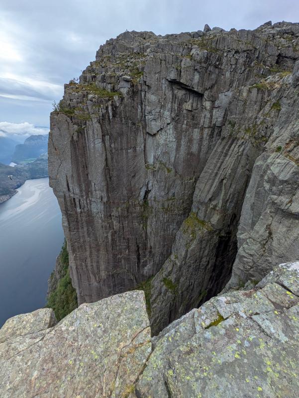 This photo shows a cliff next to a fjord in Norway.