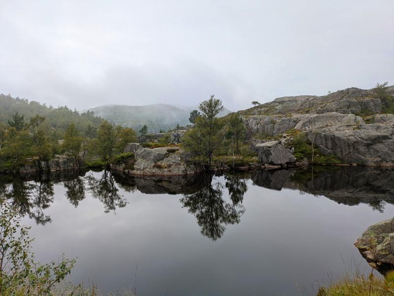 This photo shows a lake in the mountains in Norway.